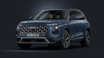 Vue de face en biais du SUV Audi Q7 avec pack extérieur S line sur fond sombre.