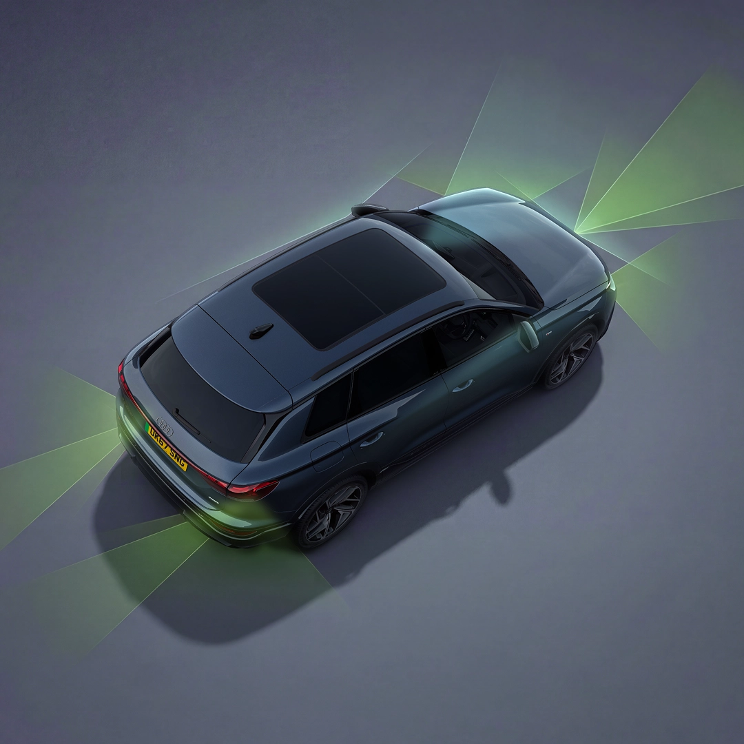 The Q6 SUV e-tron from an angle above. From the rear and front, green and blue vectors divide the areas behind and in front of the vehicle.