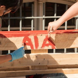 Audi Interaction employees paint something during Audi Social Day.