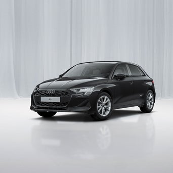 Ein Audi A3 Sportback von schräg vorne fotografiert vor einer modernen Kulisse.