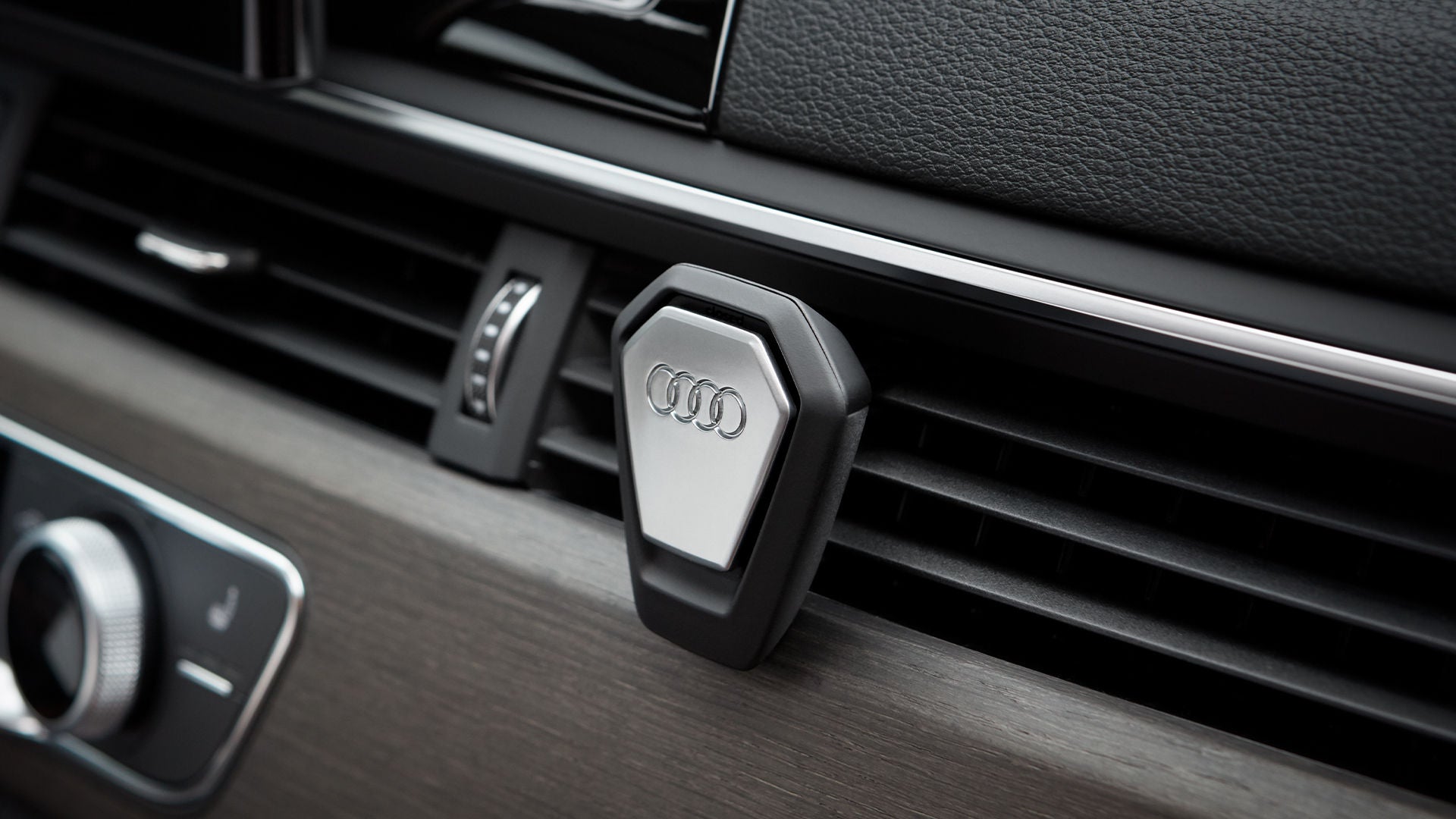 Audi e-tron GT side view on gravel surface in front of a house