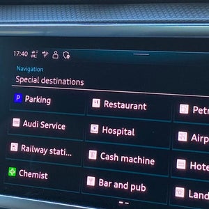 Close up of a car screen showing a list of services in the area