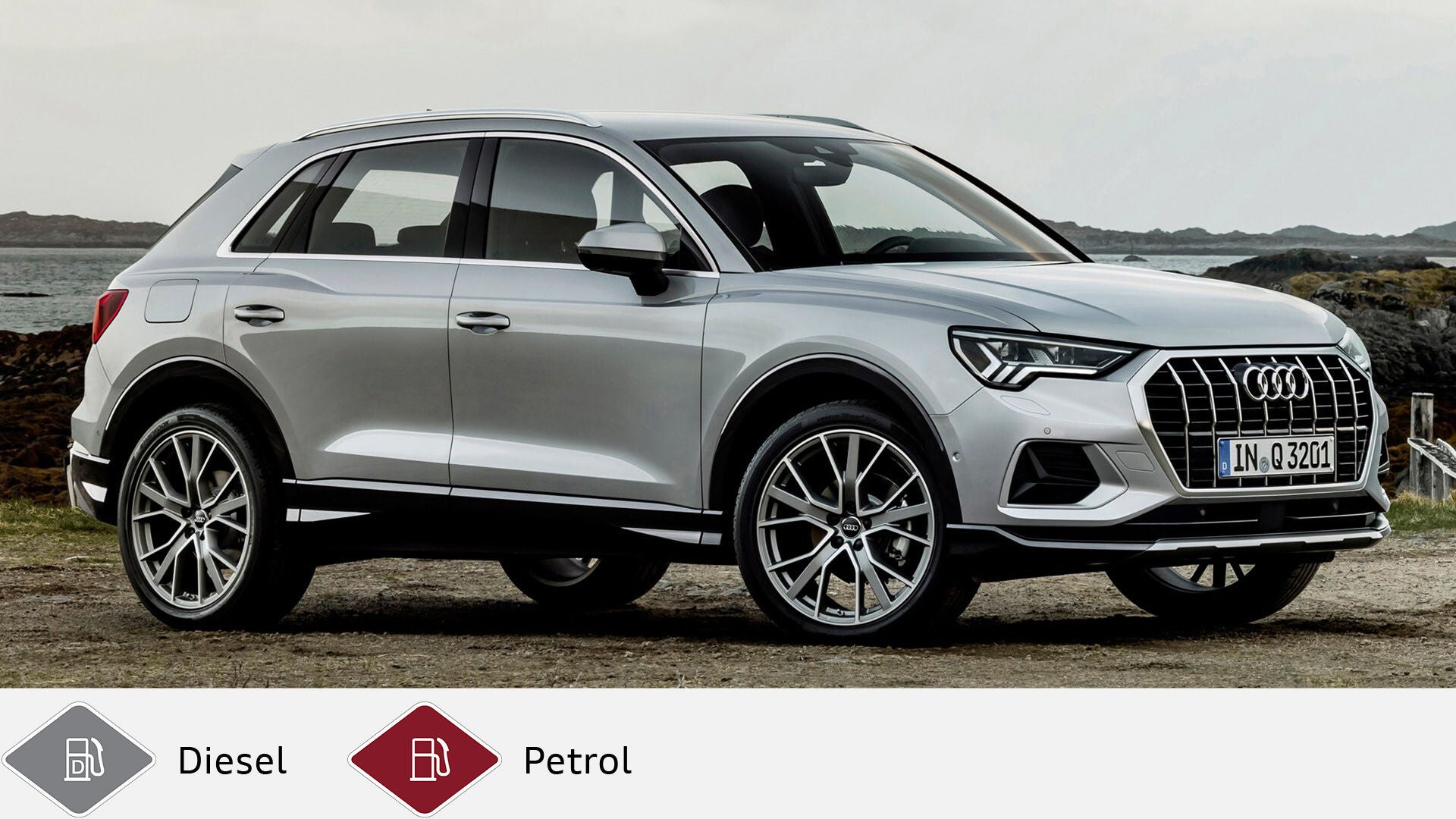 Silver Audi Q3 standing on unpaved ground with the sea in the background, side view. Below gray diesel symbol and red gasoline symbol.