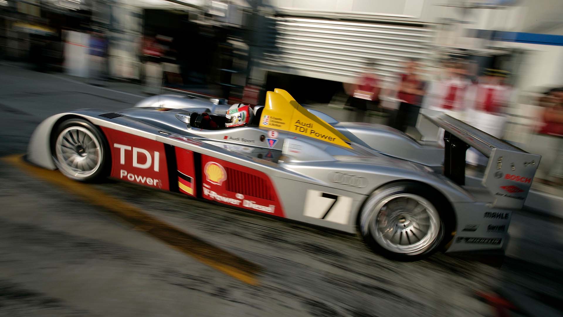 A picture of an Audi R10 TDI exiting the pit lane at Le Mans in 2006.