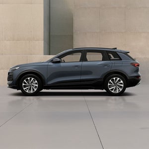 Left side of a charcoal Q6 e-tron Audi vehicle