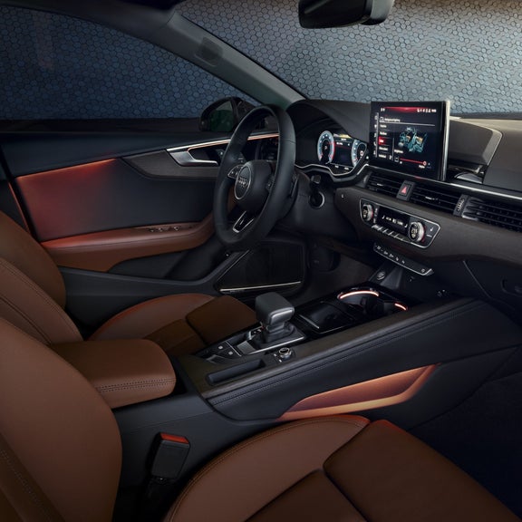 Car's interior with leather seats and modern dashboard.