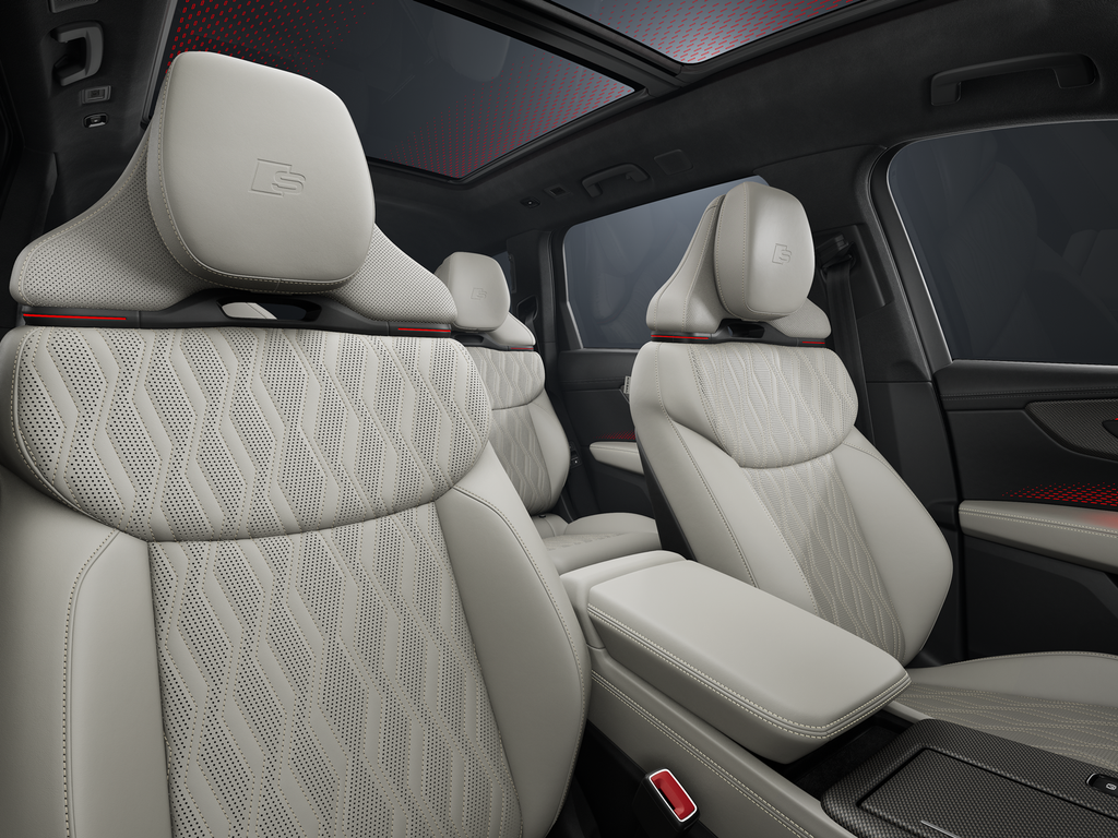 A view of the interior from the passenger side, focusing on the first two rows of seats.