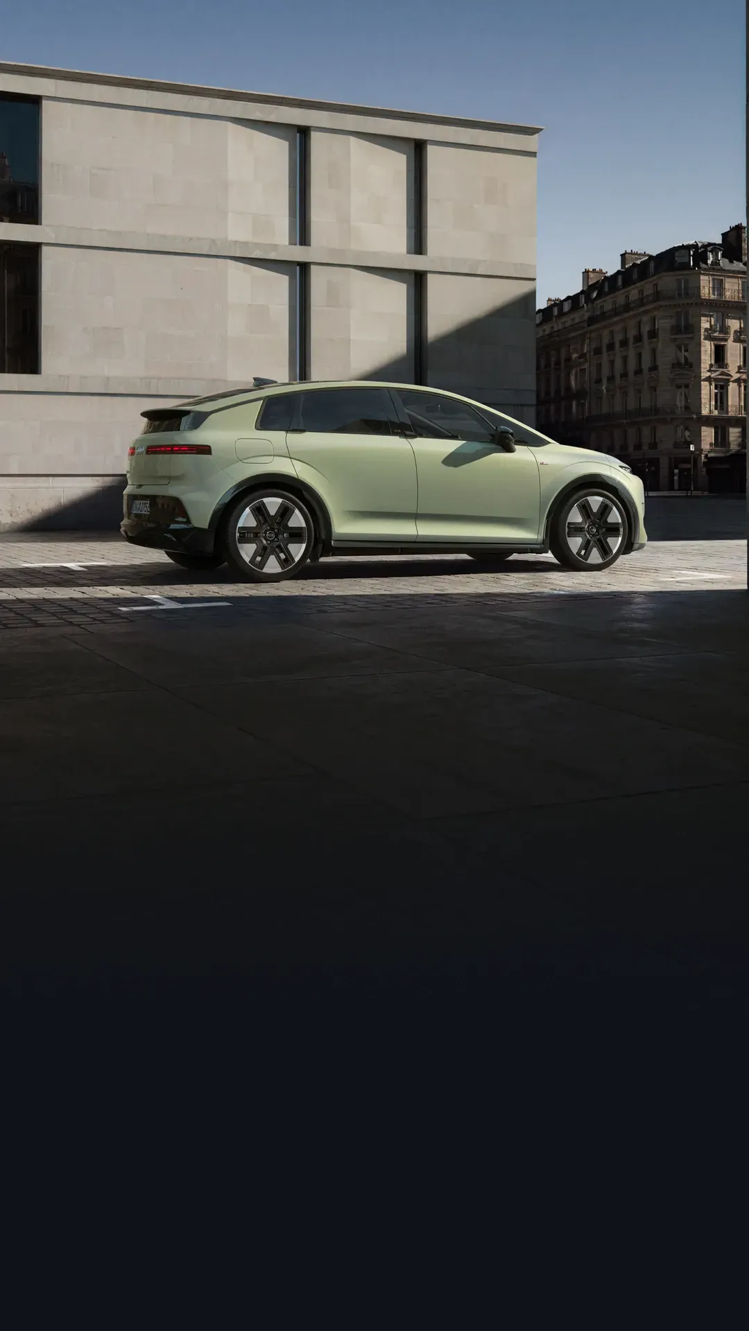 Pale green Audi A2 e-tron electric hatchback parked on a city street