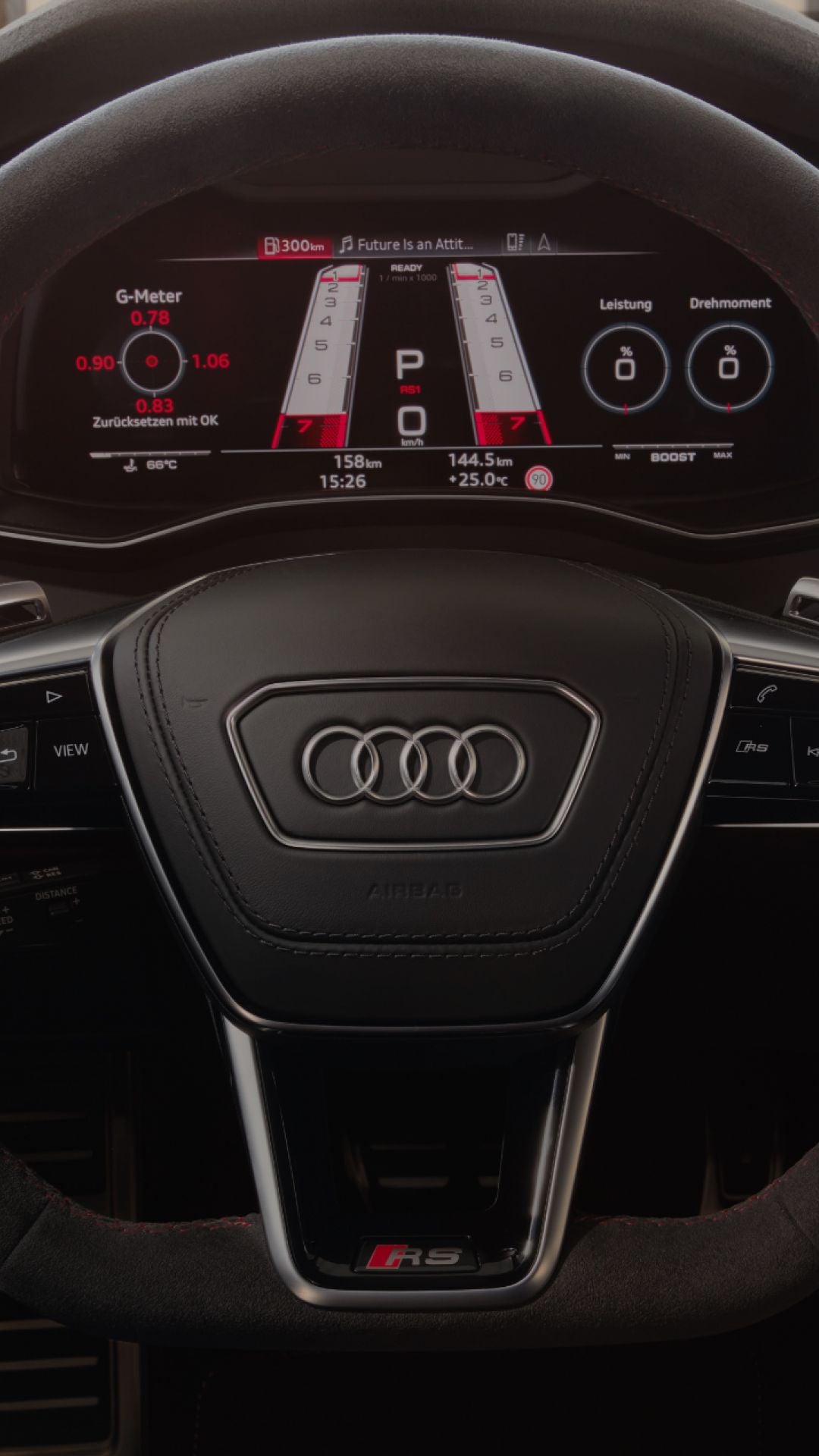 Interior view of an Audi car with a digital dashboard and steering wheel visible.