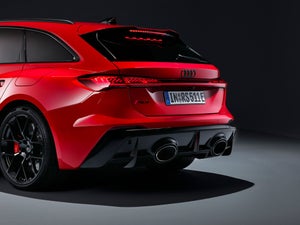 The RS 5 Sedan viewed diagonally from the front, with focus on the front half of the vehicle.