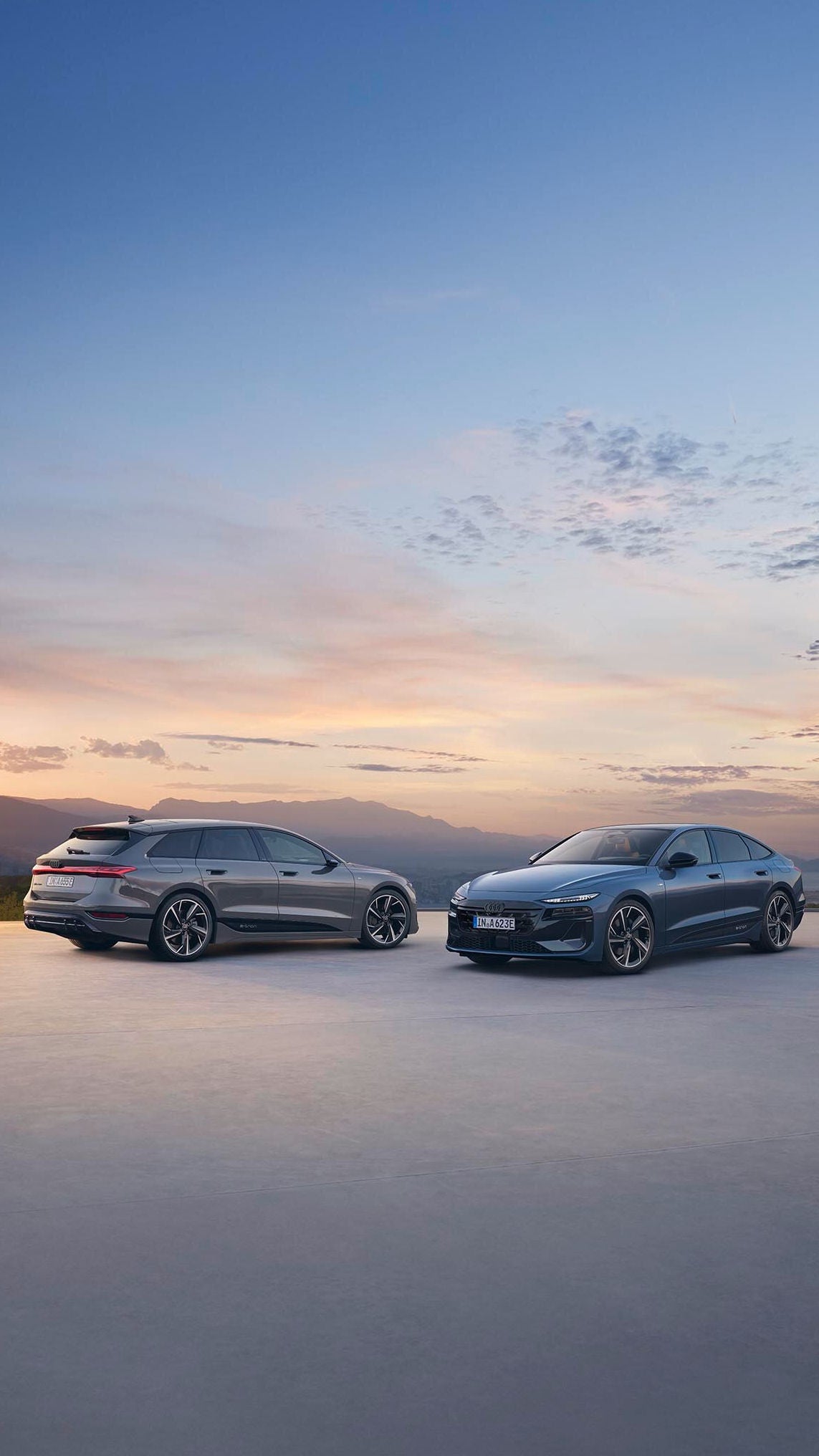 De Audi A6 e-tron met een ondergaande zon op de achtergrond