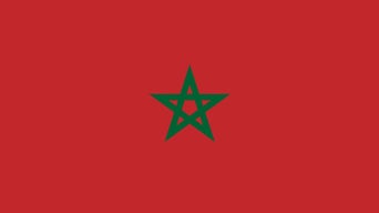 Flag of Morocco with a red background and a green five-pointed star in the centre.