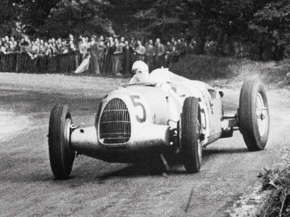 A picture showing an Auto Union Grand Prix race car at the Donington circuit in 1937.