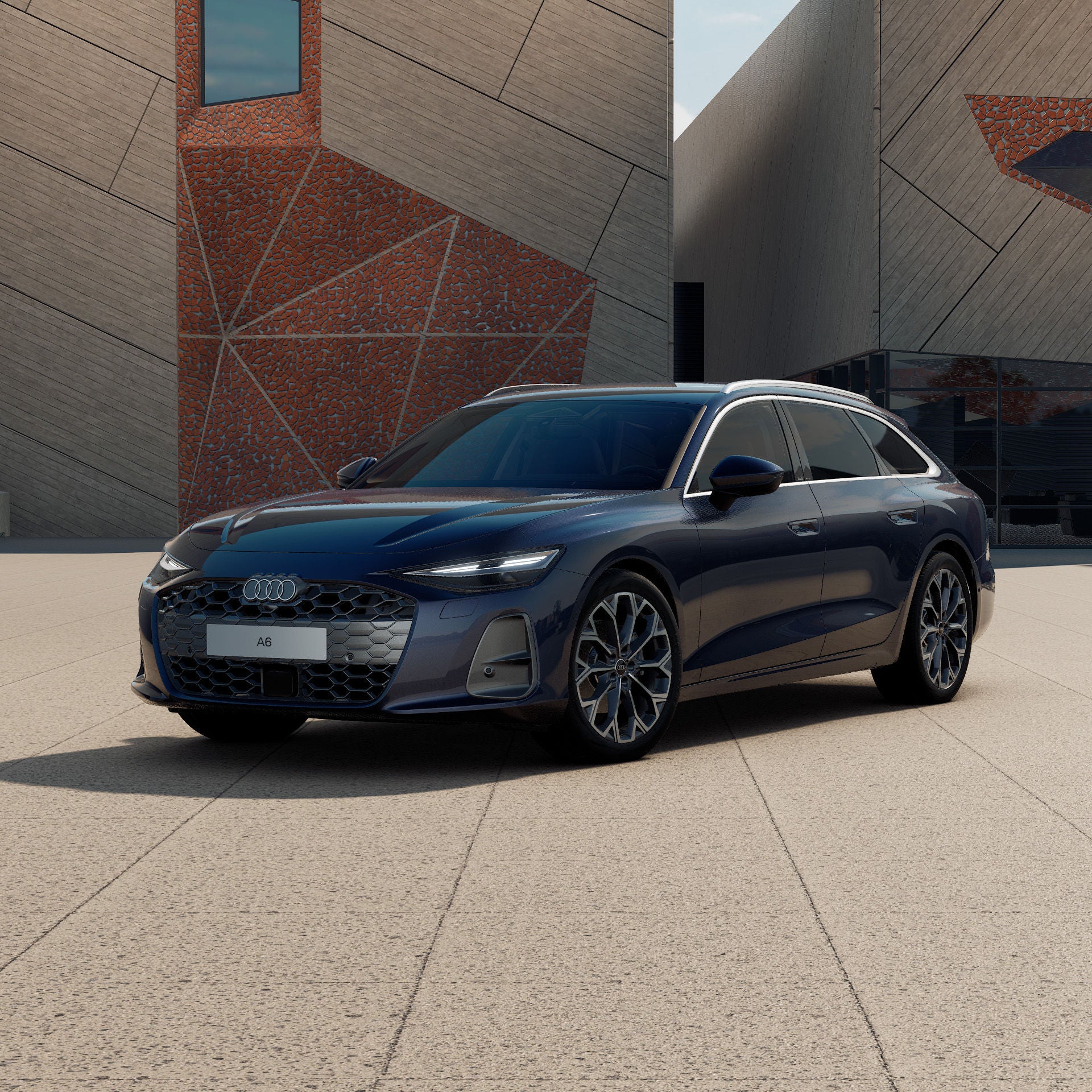 Ein Audi A6 Avant in Firmamentblau Metallic schräg von vorne fotografiert vor einer futuristischen Kulisse