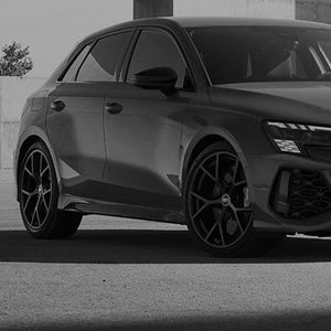 A grey image showing an Audi RS 3 Saloon