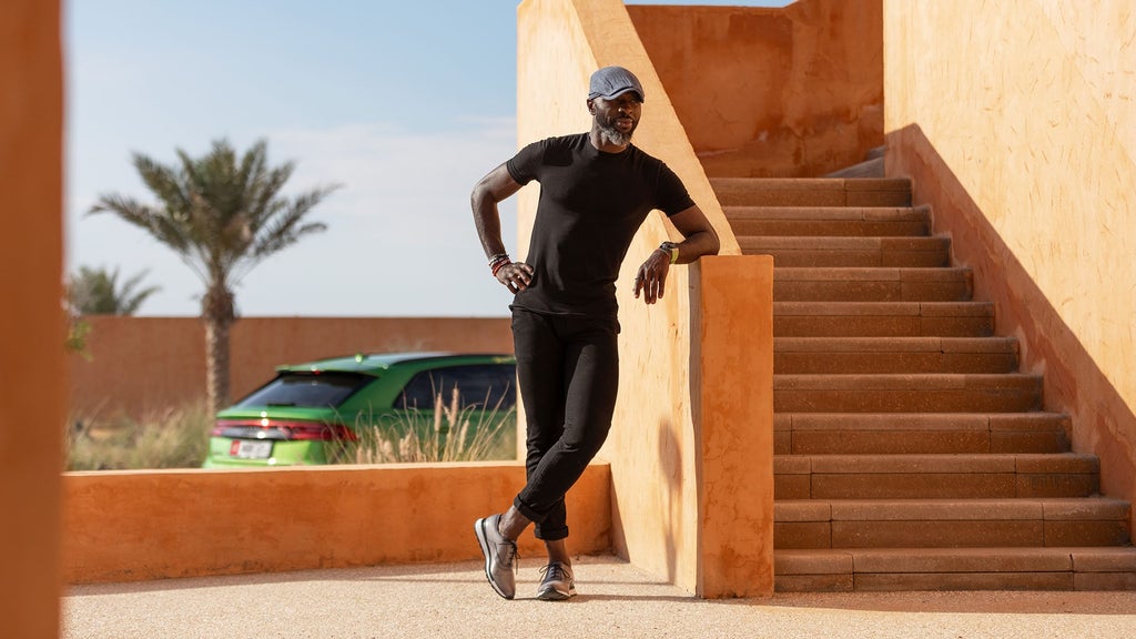 Chef Izu with peppers, the Audi RS Q8 in the background.