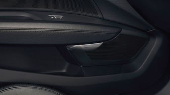Close up of an Audi door interior with black details