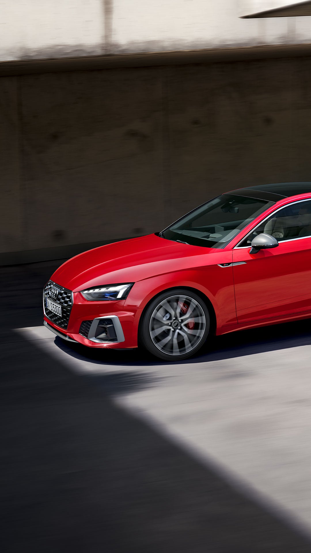 Dynamic side view of the Audi S5 Coupe