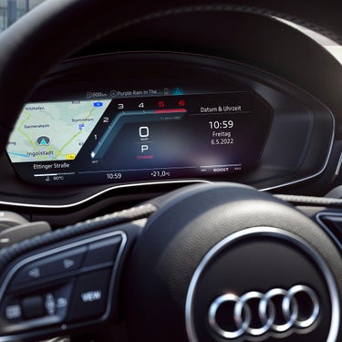 Digital dashboard of a car displaying a map, speedometer, and music track information.