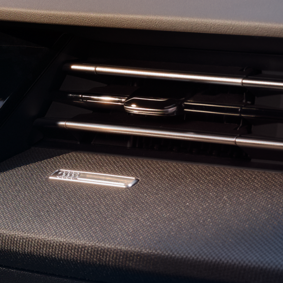 Close-up of Audi A3 Sportback interior, showing air vent and trim.