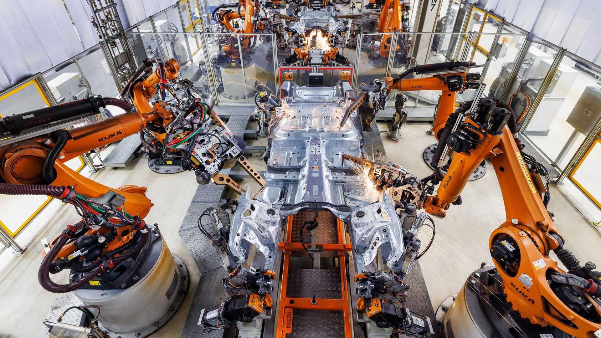 Welding robots at work on the production line in the factory hall in Neckarsulm.
