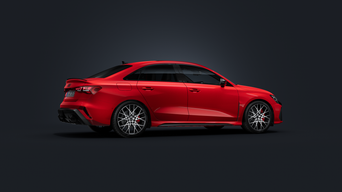 Audi RS 3 Sedan, sedd från sidan mot en mörk bakgrund.