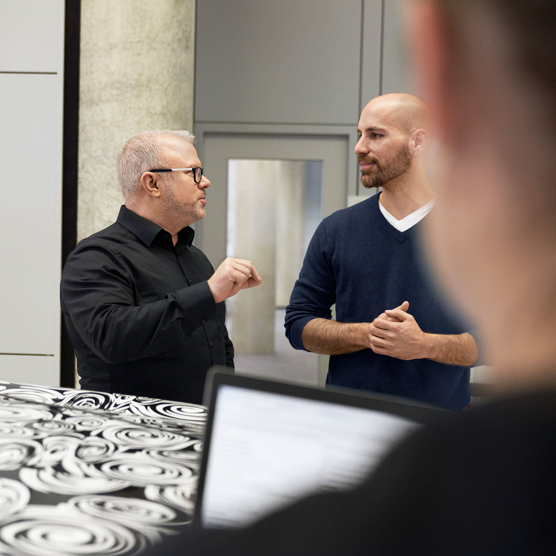 Steffen speaks with colleagues