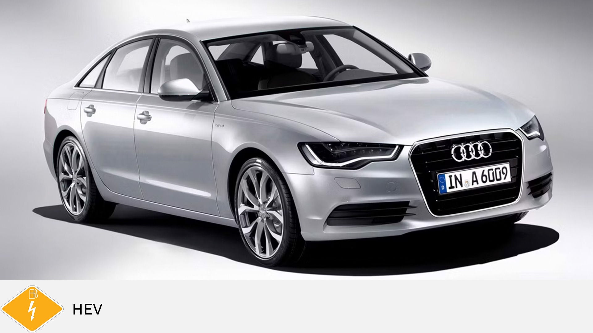 Silver Audi A6 hybrid in the studio against a neutral background. Below, yellow PHEV symbol with petrol pump and lightning bolt.