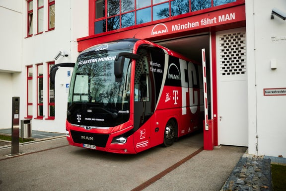 Club bus of FC Bayern drives out of the garage