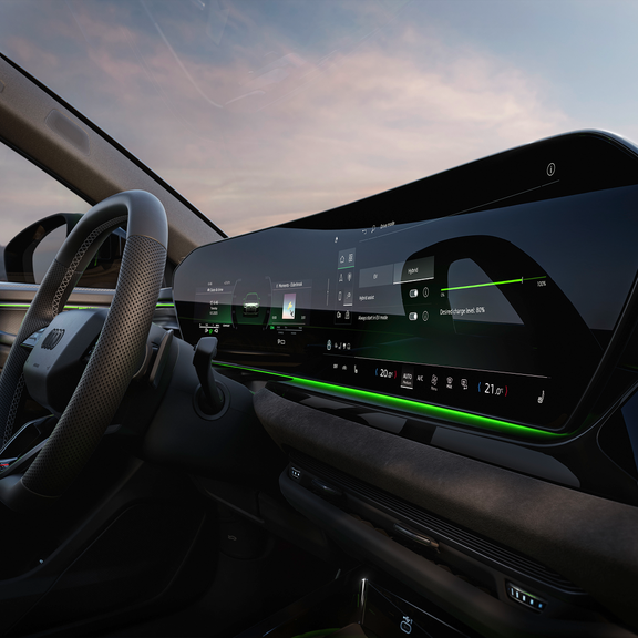 A sleek car interior featuring a futuristic touchscreen dashboard, digital controls, and ambient green lighting.