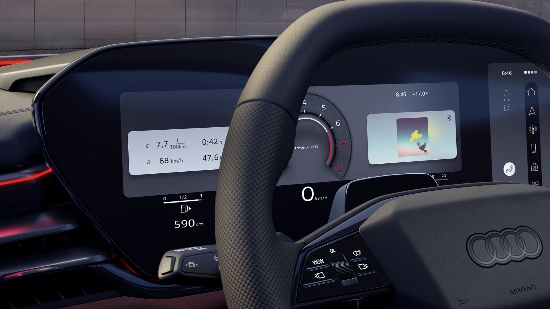 Close-up of the steering wheel and driver display in the cockpit.