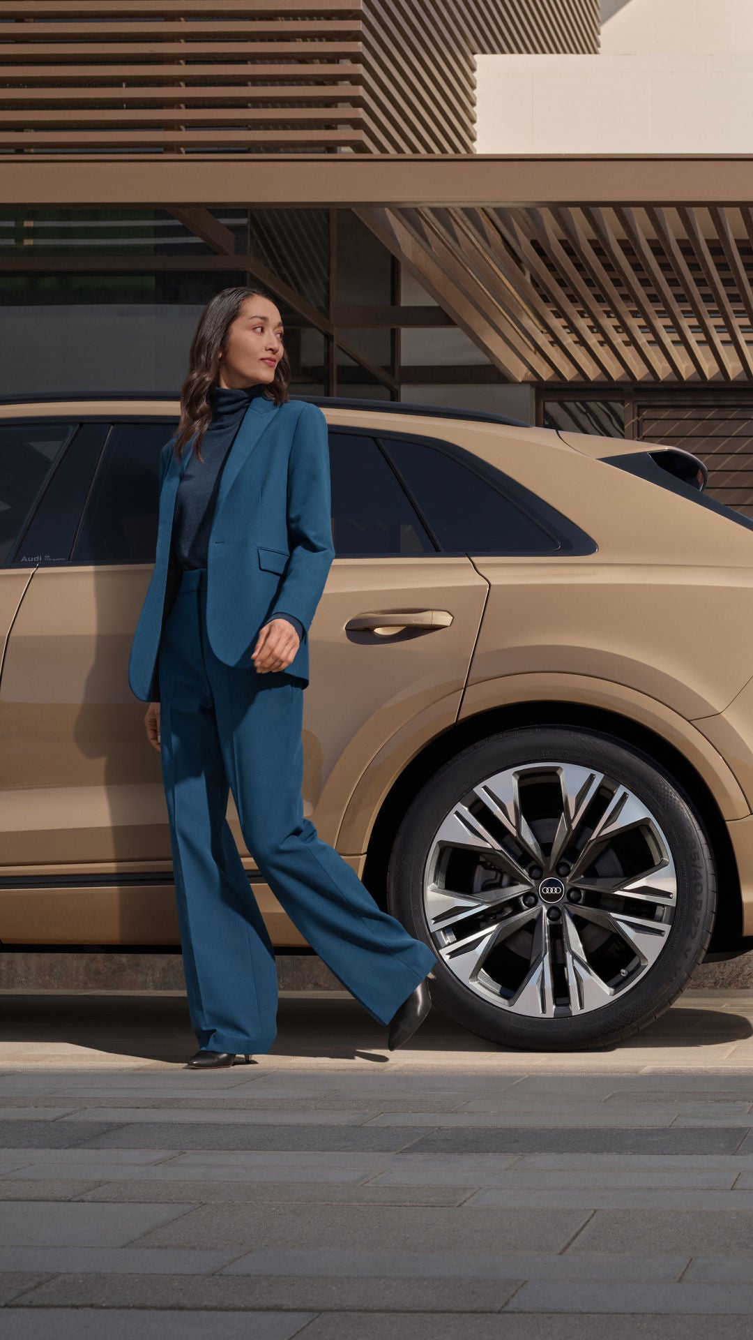image of a woman in front of a car