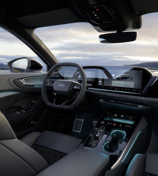 Utsikt från baksätet mot förarplatsen i A5 Avant e-hybrid.