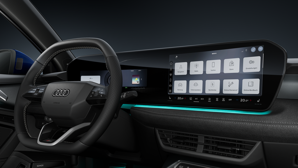 A close-up of the sports leather steering wheel and the curved panoramic display.