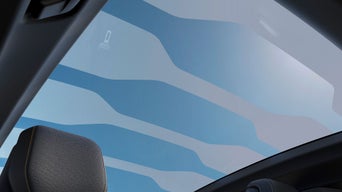 Red Audi e-tron GT quattro on the move in a coastal road