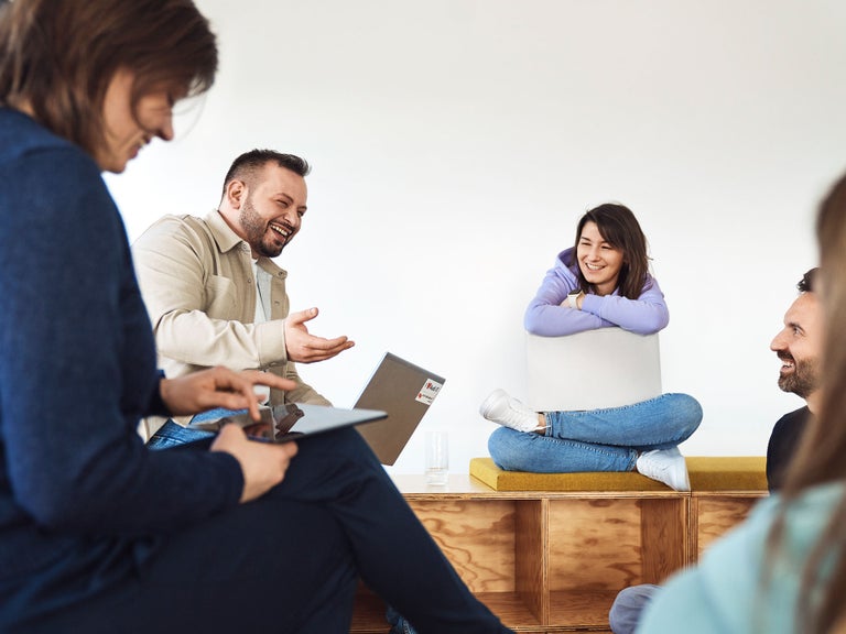Sevgi talks with her colleagues