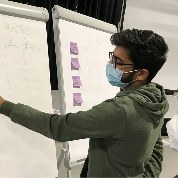 Man writing something on a whiteboard