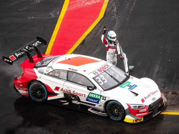 A picture of René Rast celebrating his DTM title at Hockenheim in 2019.
