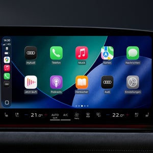 Nahaufnahme eines Displays im Fahrzeuginnenraum. Abgebildet sind diverse App-Icons, unter anderem myAudi, Musik und Nachrichten.