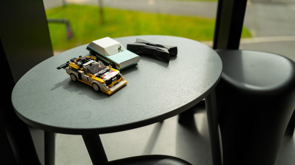 a black round table with toy cars