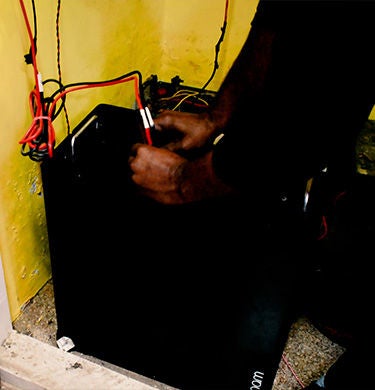 Person working on a power generator
