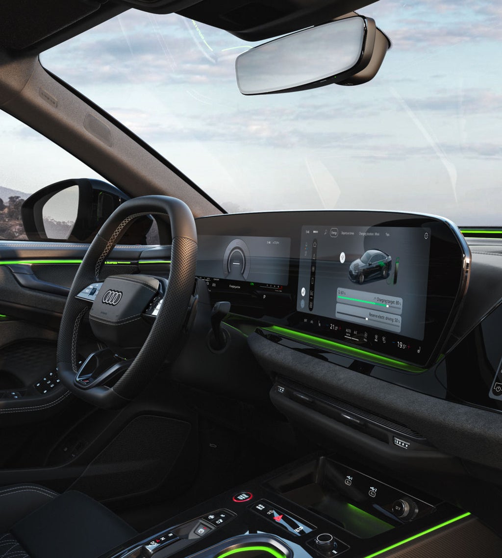 View of the cockpit from the passenger seat, illuminated by green ambient lighting.