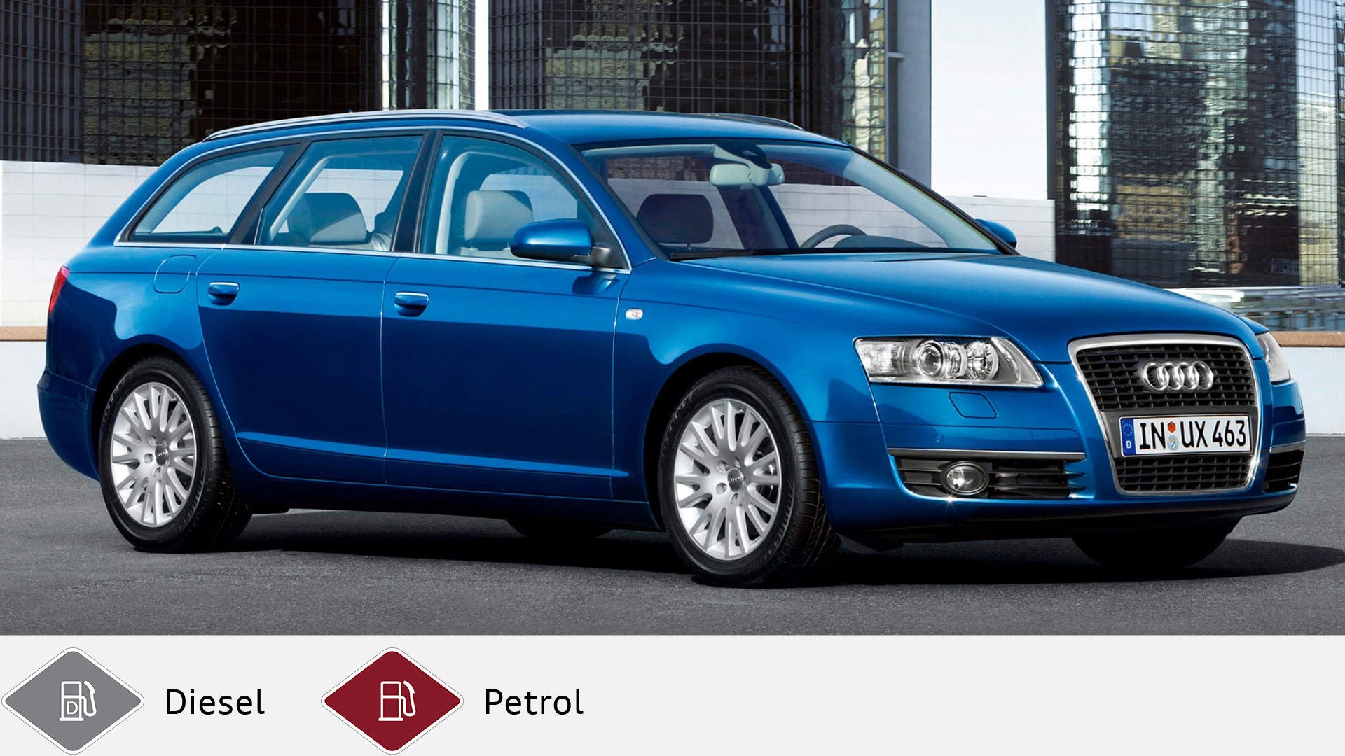 Blue Audi A6 Avant (2004-2012) with classic station wagon design in front of a high-rise façade. Gray diesel symbol and red petrol symbol at the bottom.
