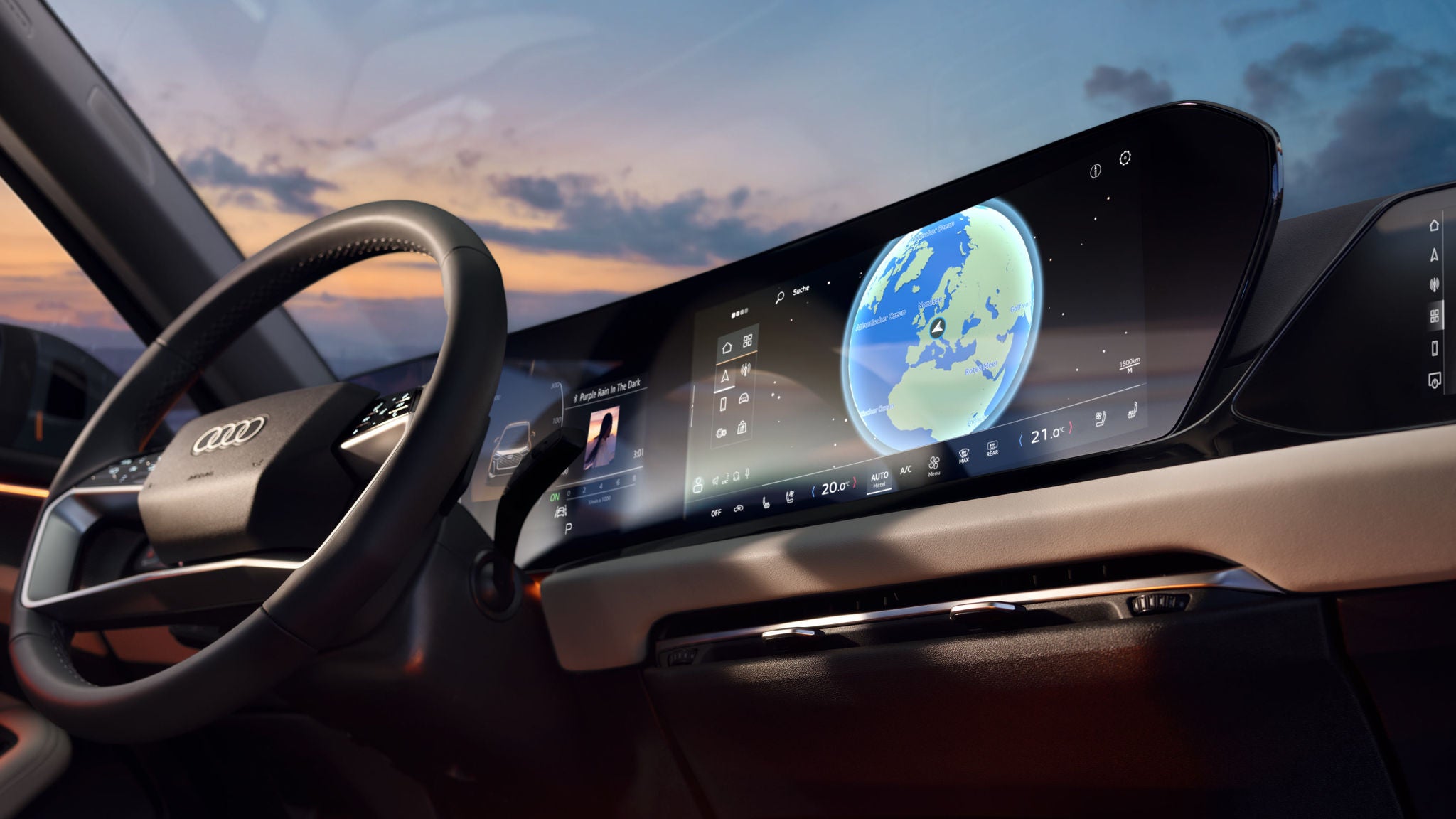 Blick ins Audi-Cockpit mit großem Display, das eine Globus-Navigation zeigt.