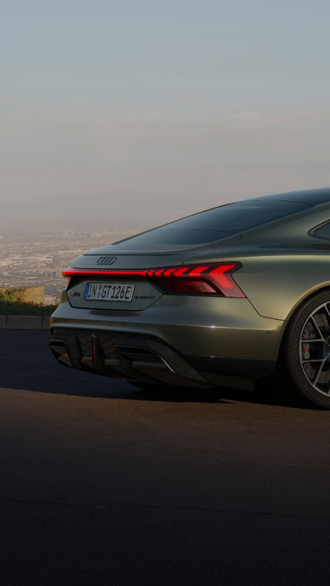 Green Audi e-tron GT car rare view on a hill