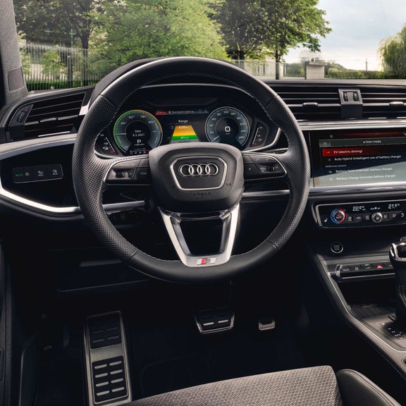 Driver side cockpit view of Audi Q3.
