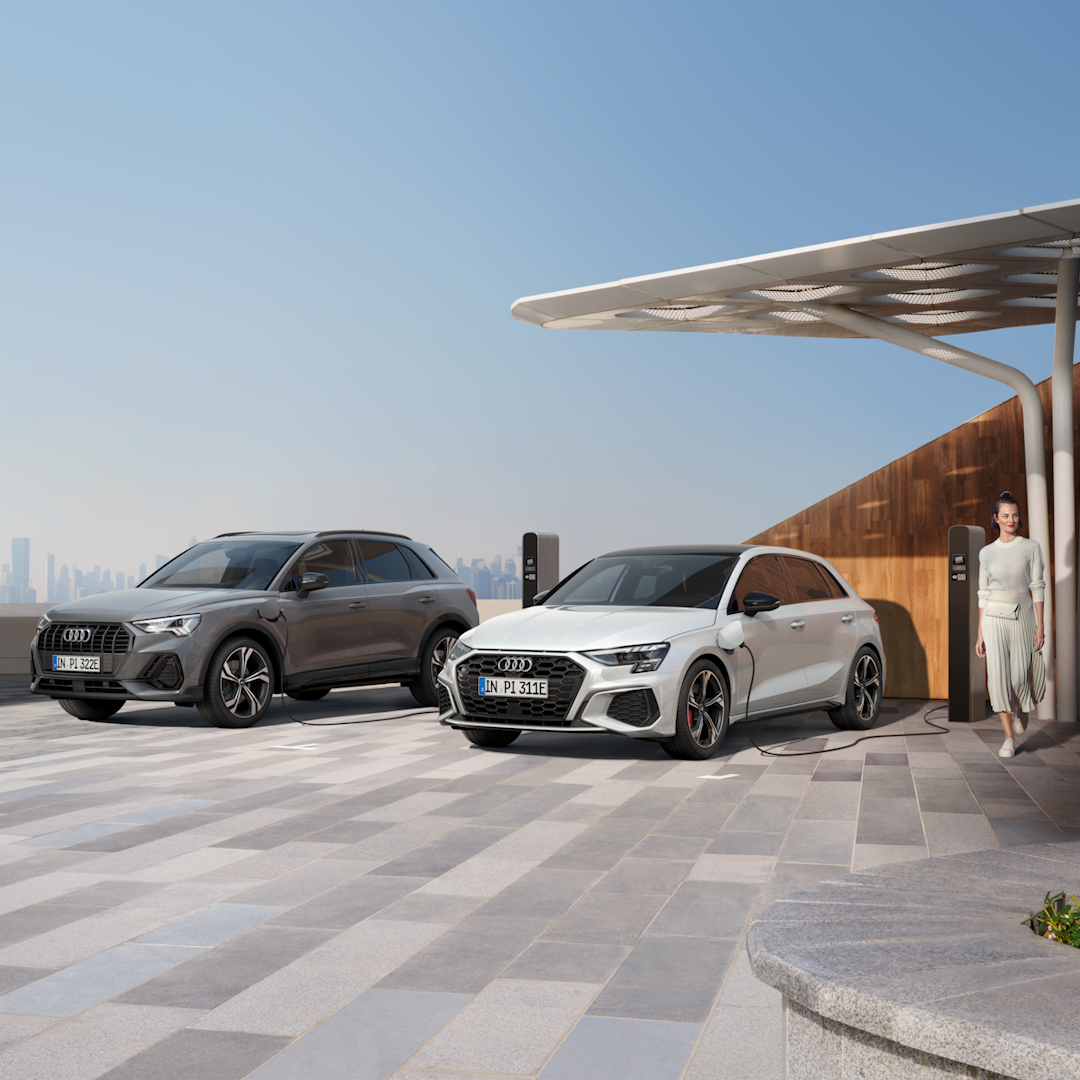 Et billede af en Q3 og A3 plug in hybrid parkeret