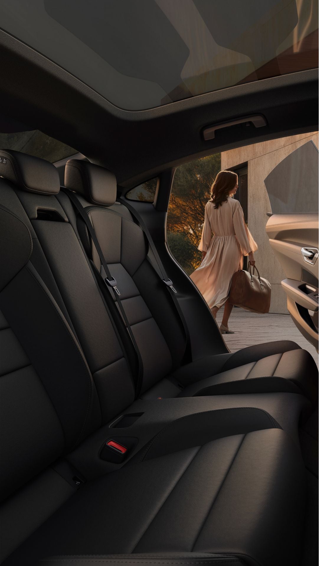 Car interior features sleek black leather seats, while a woman in a flowing dress walks away with a handbag.