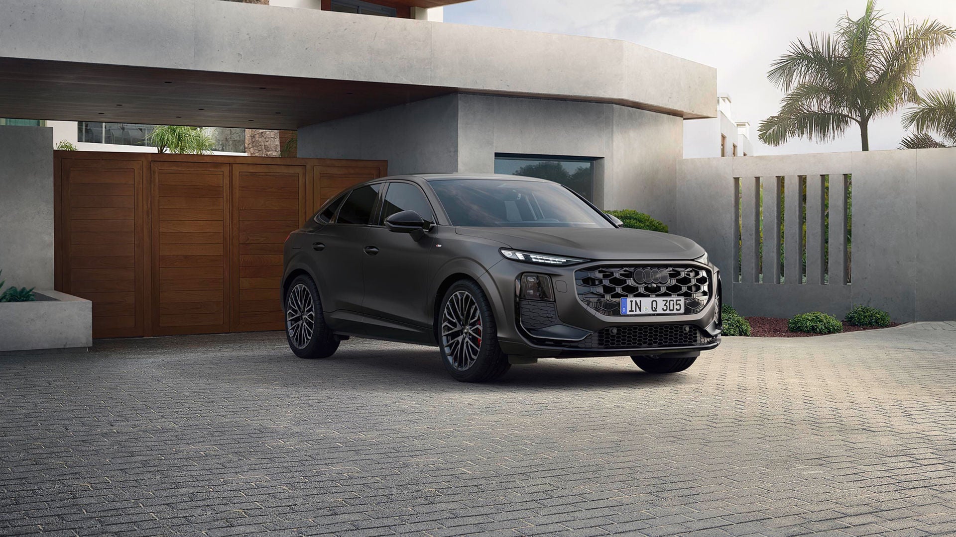 The Audi Q3 Sportback parked outside a home