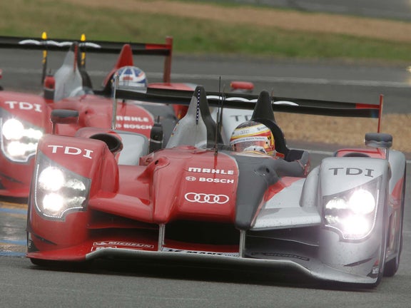 A picture showing the victorious Audi R15 TDI on track at Le Mans in 2010.